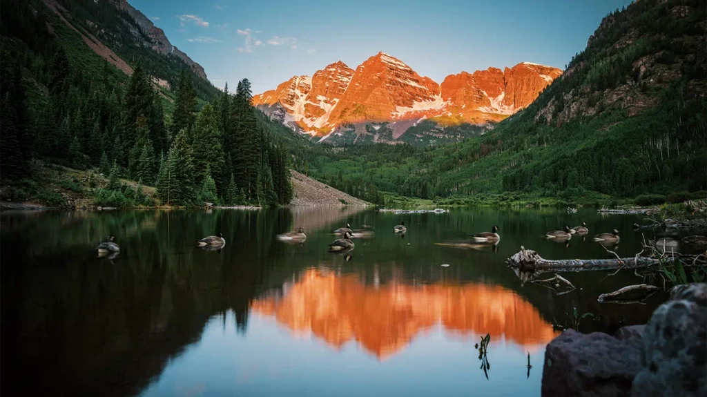 Scenic view of Maroon Bells mountains and Maroon Lake near Aspen Snowmass Colorado, popular destination with shuttle service access