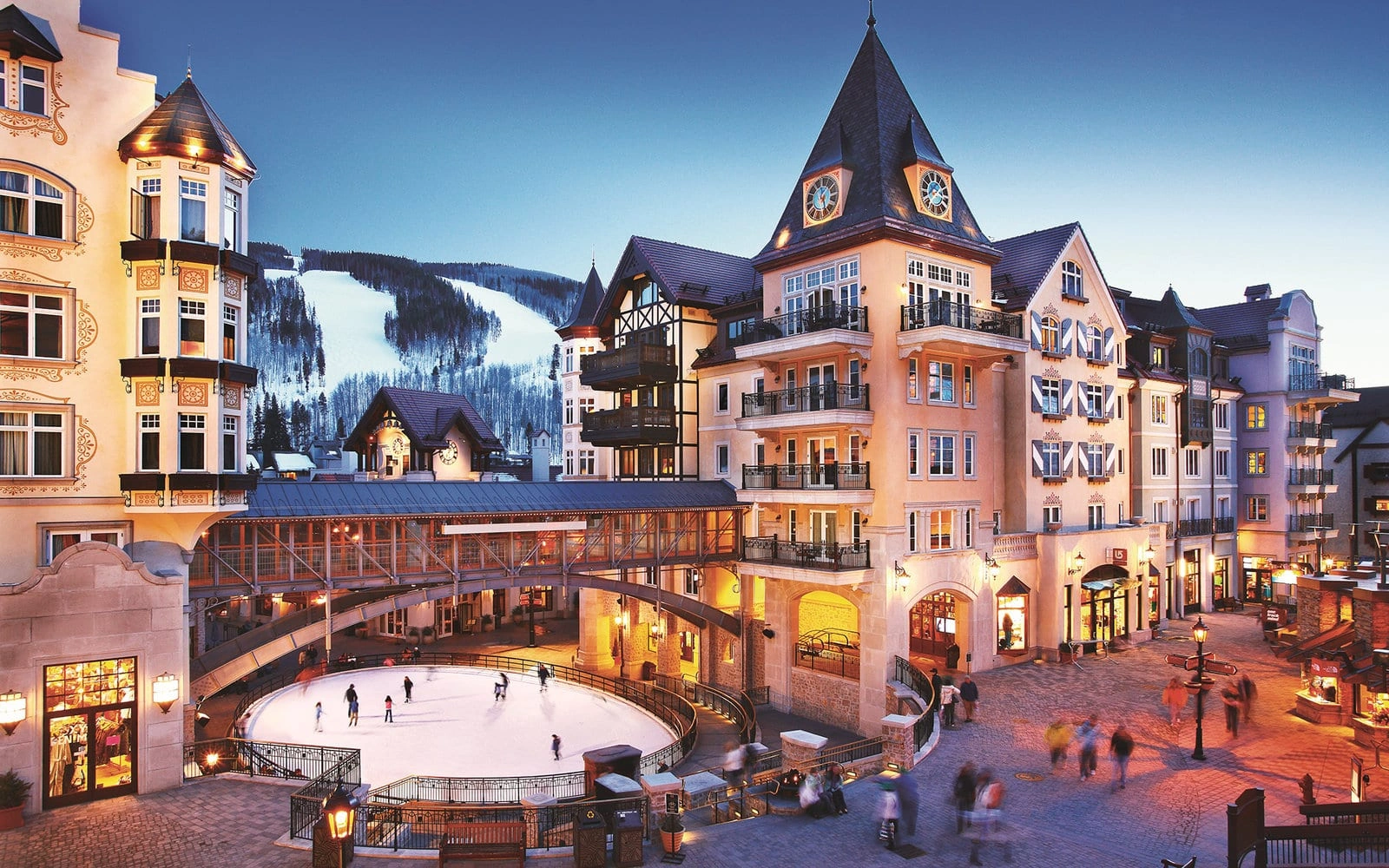 Vail Village Colorado with ski slopes, luxury hotels, ice skating rink, and private shuttle service from Denver airport