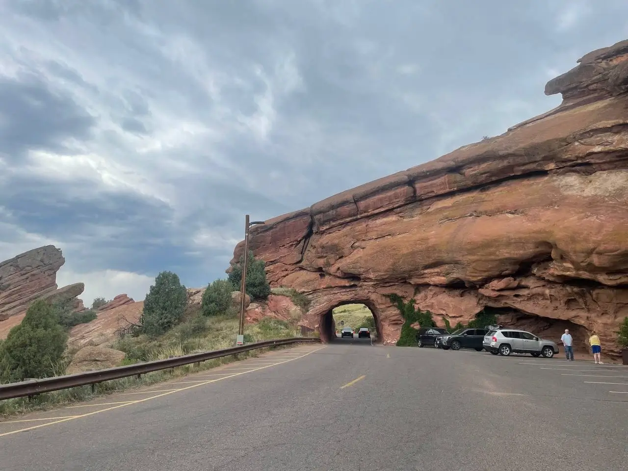 Scenic Colorado red rock tunnel near Red Rocks Amphitheatre with shuttle service parking and transportation access