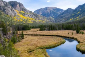 Rocky Mountain National Park, Colorado with scenic valley, river, and autumn colors — shuttle service and private transportation.
