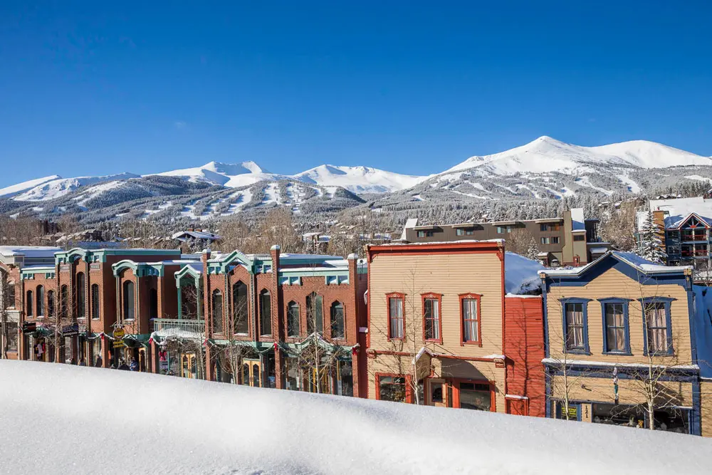 Downtown Breckenridge Main Street and ski slopes. Private airport shuttle to Breckenridge by Mr. Chauffeur Colorado.