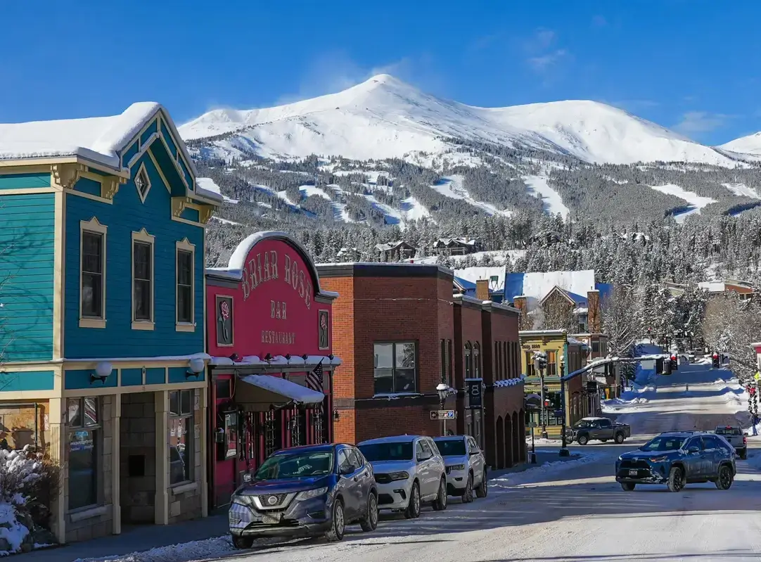 Scenic view of downtown Breckenridge, Colorado, and its ski resort, a key destination for our private shuttle and airport transportation service.