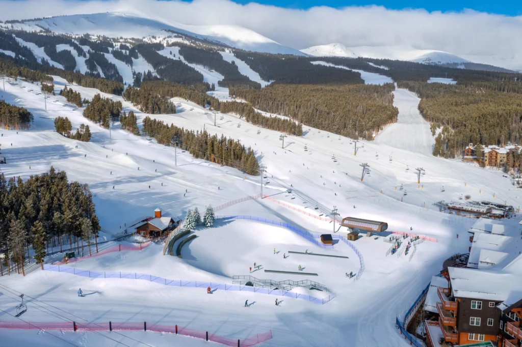 Sunny Colorado ski resort slopes and chairlifts. Private airport transportation to ski resorts by Mr. Chauffeur Colorado.