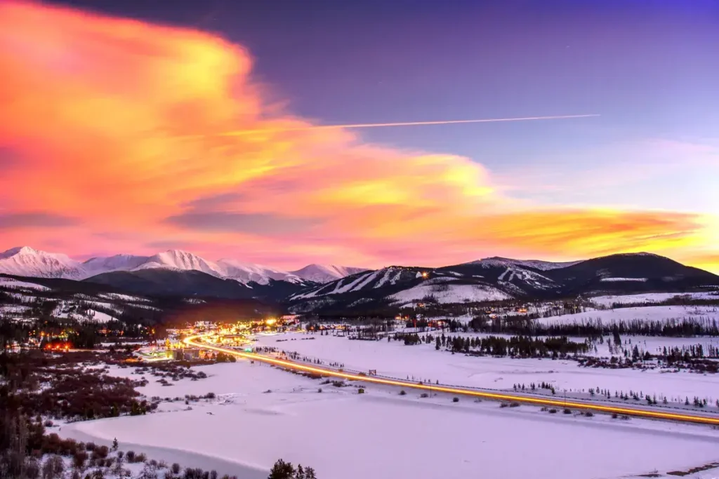 Vibrant sunset over Winter Park, Colorado, and its ski resort, a premier destination for our reliable DIA airport shuttle and private car service.