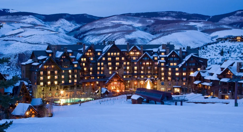 Ritz-Carlton Bachelor Gulch hotel exterior in winter. Private shuttle service to Bachelor Gulch by Mr. Chauffeur Colorado.