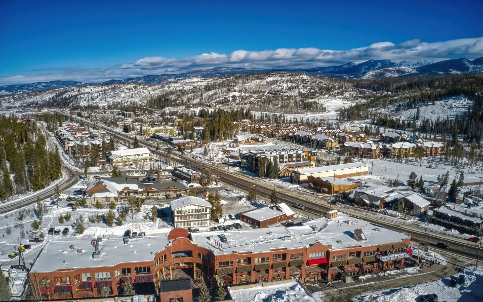 Winter Park town and snowy mountains. Private shuttle service from Denver to Winter Park. Mr. Chauffeur Colorado.