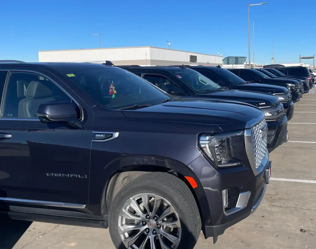 Our fleet of black luxury SUVs featuring GMC. Private airport car service by Mr. Chauffeur Colorado