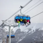 Ski lift gondola ascending a mountain in the Colorado Rockies