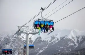 Ski lift gondola ascending a mountain in the Colorado Rockies